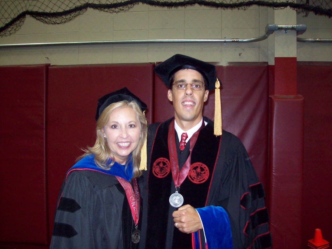 Dr. Wright and Dr. Hardin in regalia at his graduation